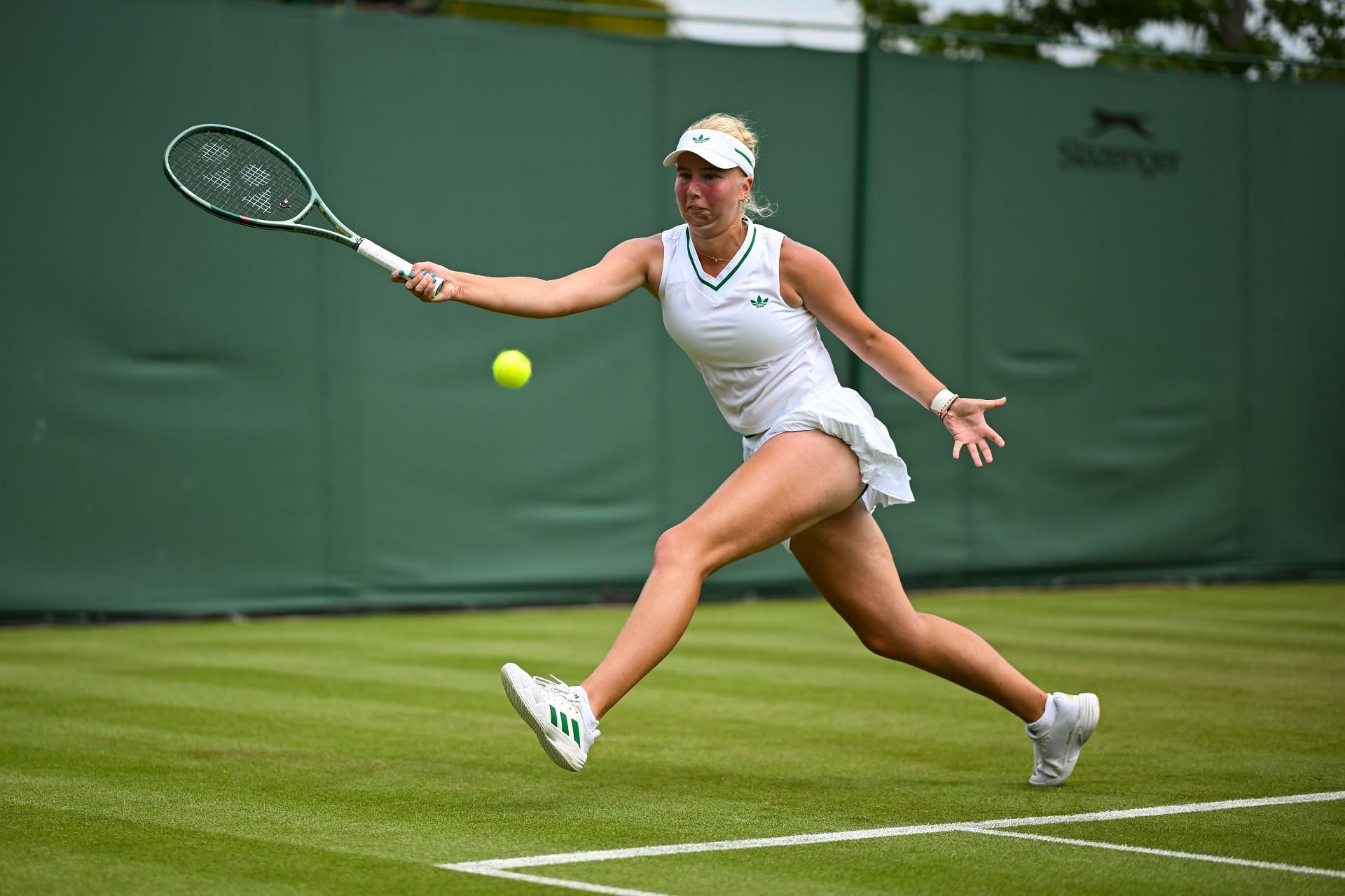 Clara Tauson tracks down a ball at Wimbledon | Image Source: Getty